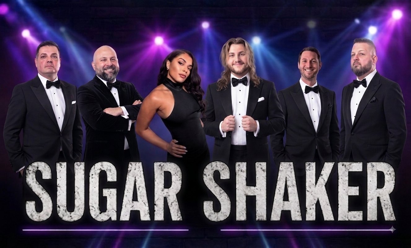 Sugar Shaker — the full band in black-tie under concert lighting