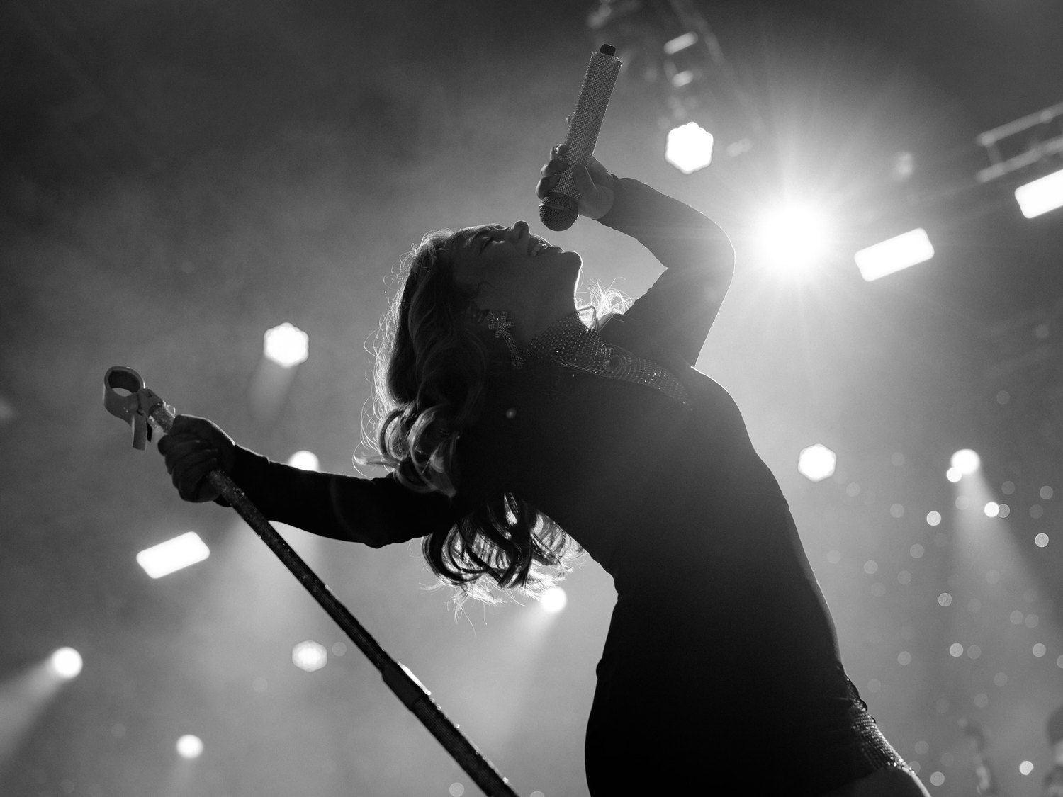 Sugar Shaker's lead vocalist performing under stage lights