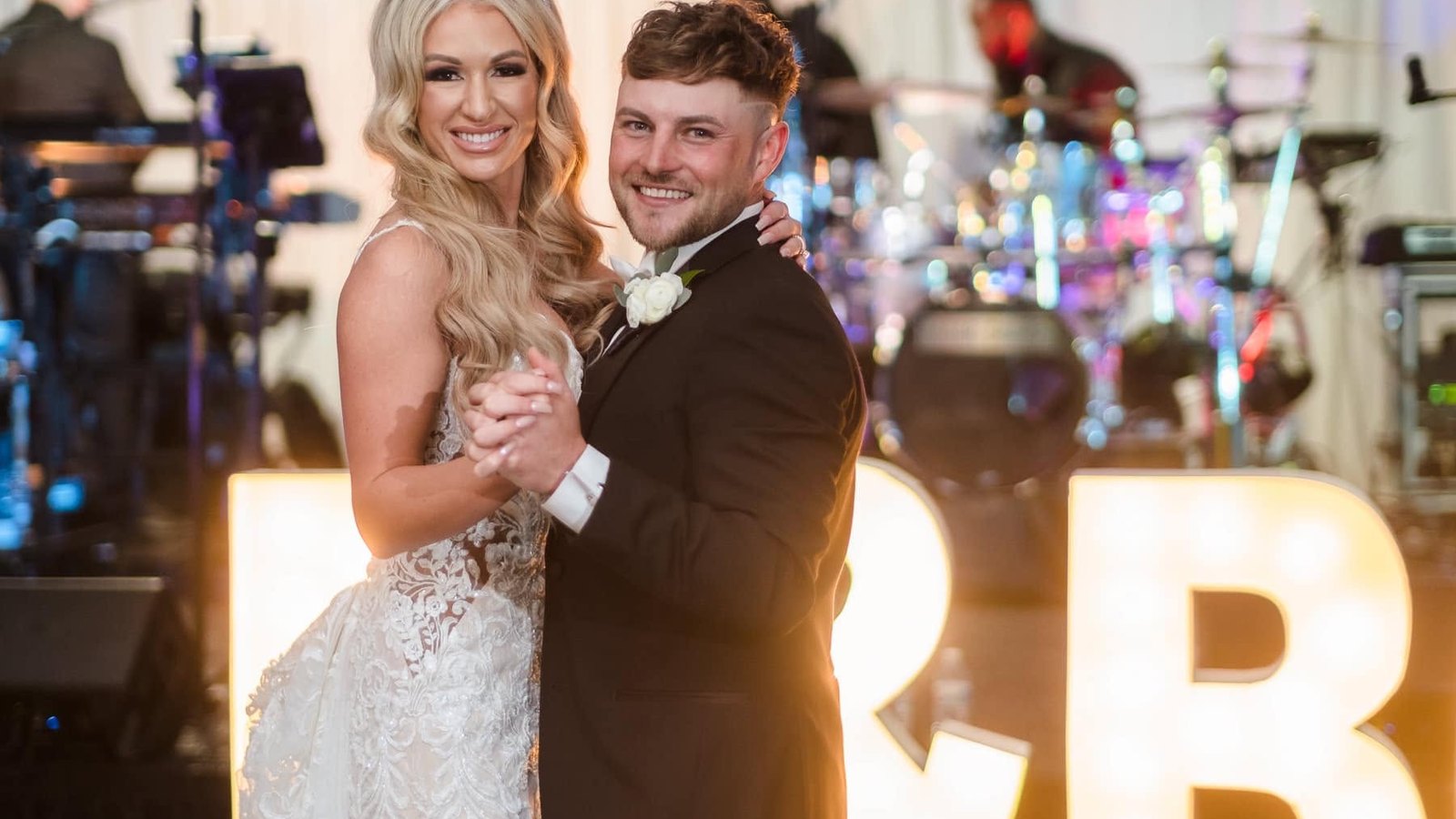 A couple's first dance in front of the Sugar Shaker band at a New Orleans wedding reception