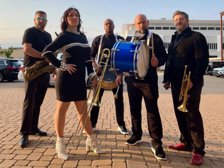 The Sugar Shaker brass band lineup ready for a New Orleans second line parade